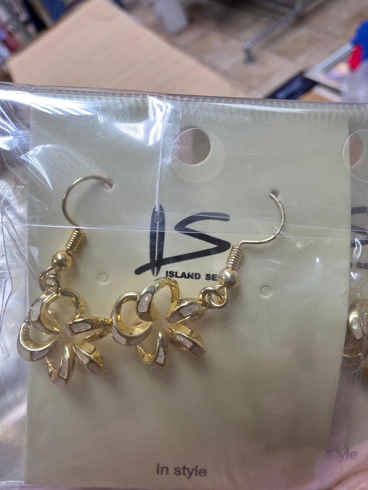 White synthetic opal crystal-plumeria ribbon gold-tone earrings