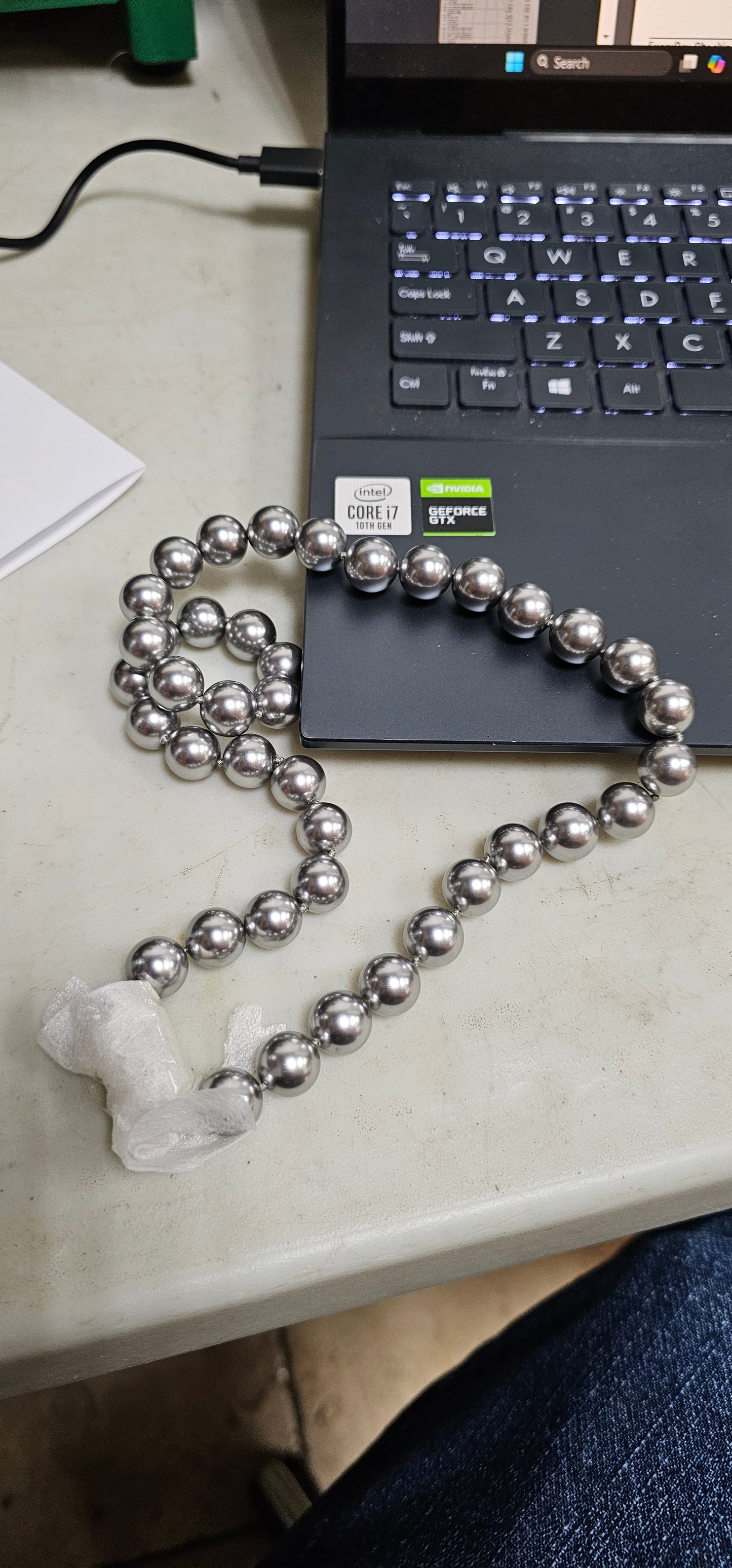 Silver pearl necklace with glitter ball